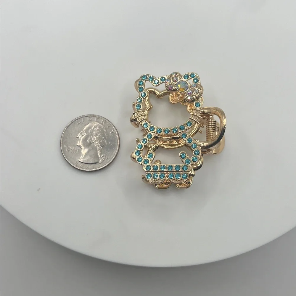 929. Gold and Blue Hello Kitty Hair Clip